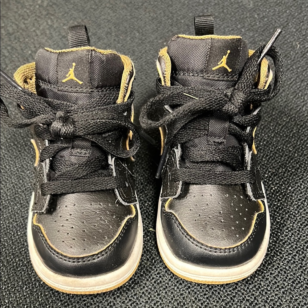Nike Air Jordan Black and Gold High-Top Sneakers